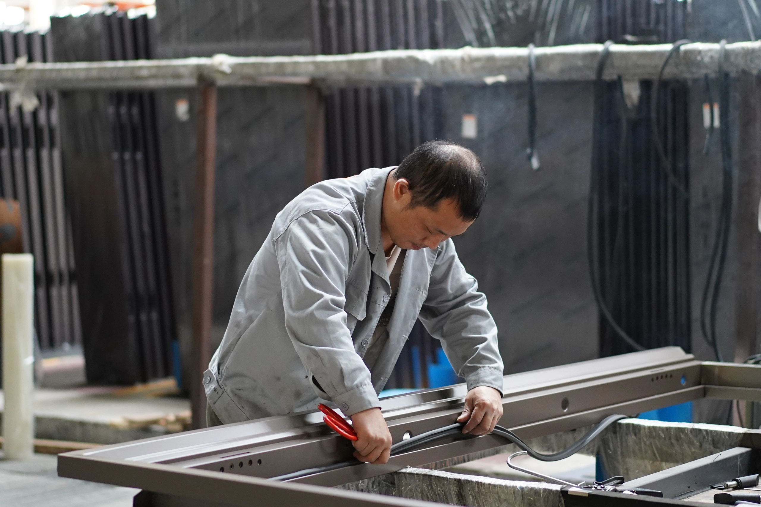 Worker assembling custom door components